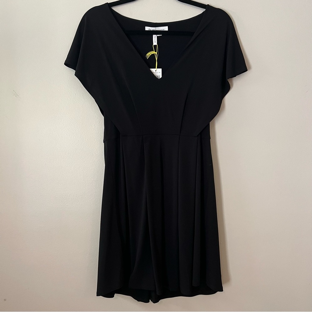 Black dress BCBGeneration Size Medium flowy loose fitting, polyester and spandex